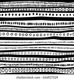 Seamless striped pattern. Black horizontal stripes on a white background. A simple ornament. Handmade. Vector illustration.