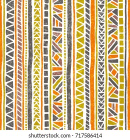 Seamless striped pattern. Ethnic and tribal motifs. Vintage print, grunge texture.Simple ornament. Handmade. Orange, green, gray and white colors. Vector illustration.