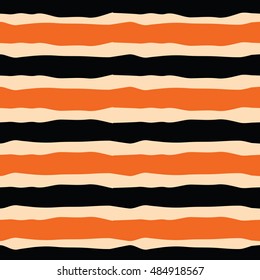 Seamless striped pattern for Halloween holiday made with black and orange colors. Bright textile or fabric hand drawn background.