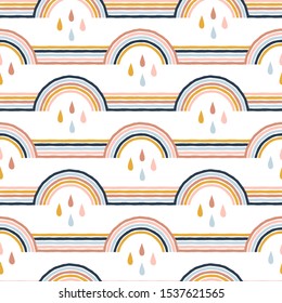 Seamless stripy pattern with hand drawn rainbows and rain drops. Creative scandinavian kids background for fabric, wrapping, textile, wallpaper, apparel. Vector illustration