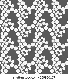 Seamless stylish geometric background. Modern abstract pattern. Flat monochrome design.Monochrome pattern with white circles on gray.