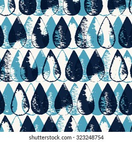 Seamless stylish pattern with blue and black drops