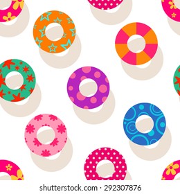 Seamless summer background with colorful swim rings
