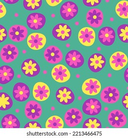 Seamless summer floral pattern. Purple and yellow flowers on green background. Wrapping or gift paper and textile