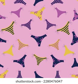seamless summer pattern with colorful panties on a pink background
