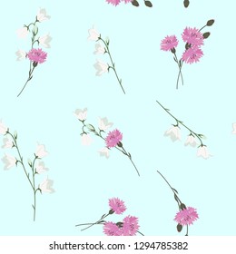 Seamless summer vector illustration with cornflowers and bells on a light blue background. For decoration of textiles, packaging and web design.