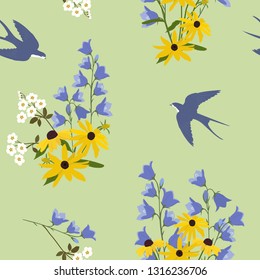 Seamless summer vector illustration with daisies, campanula and swallows on a green background. For decorating textiles, packaging and web design.