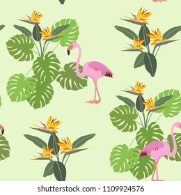 Seamless summer vector illustration with tropical leaves, flowers and pink flamingo. For decorating textiles, packaging and wallpaper.