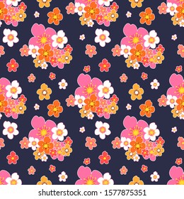 Seamless surface pattern with Asian colorful  plum blossoms on blue colored background.