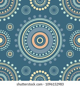 Seamless symmetric pattern of circles and dots of blue, orange and turquoise colors. Kaleidoscope background. Decorative wallpaper, good for printing. Vector illustration. Ethnic style