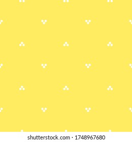 Seamless symmetric pattern with little circles and dots on yellow. Decorative wallpaper, good for printing.
