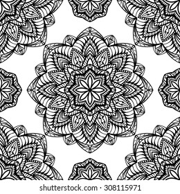 Seamless, symmetrical black pattern on a white background. Oriental ornament of mandalas.
