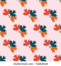 seamless symmetrical pattern in pastel colors of maple leaves of different colors. The pattern for the ornaments, albums, backgrounds. 