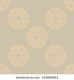 Seamless tan ornament on background. Wallpaper pattern