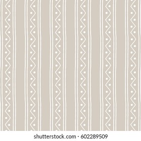 Seamless textile vector pattern. White vertical lines and zigzags with circles on grey background. Hand drawn abstract ornament