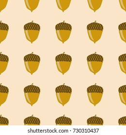 Seamless texture. Acorns on a pink background