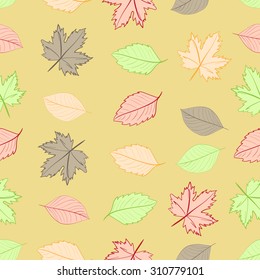 Seamless texture with autumn color leaves on a brown background