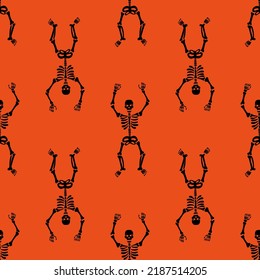 Seamless texture with black skeletons dancing and having fun on a orange background.