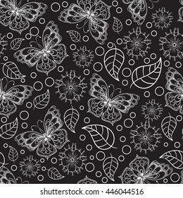 Seamless texture. Black and white pattern of butterflies, flowers and leaves.