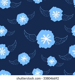 Seamless texture with blue winged snowflakes on the blue