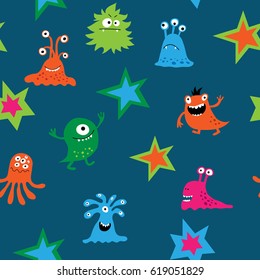 Seamless texture with a cartoon monsters on a blue background