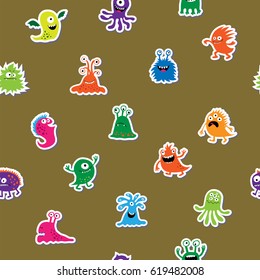 Seamless texture with a cartoon monsters on a green background