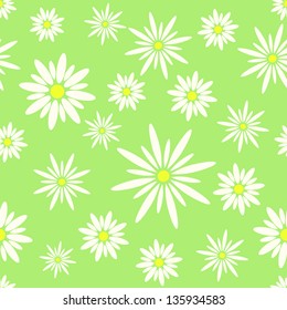 Seamless texture of chamomile on a green background
