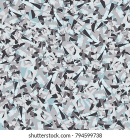 Seamless texture. Chaotically arranged colored sharp triangles. Six-color pattern. Similarity of the pattern of a chipboard.