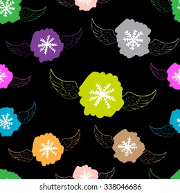 Seamless texture with color winged snowflakes on the black