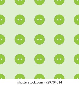 Seamless texture. Colored buttons on a green background