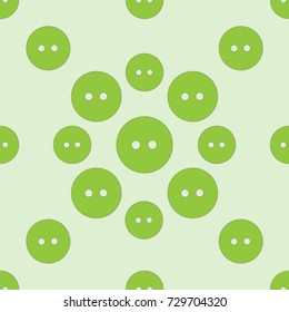 Seamless texture. Colored buttons on a green background