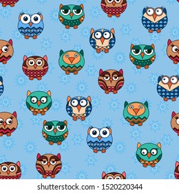 Seamless texture with colorful cartoon funny various owls for children decoration on the muted blue pattern background 