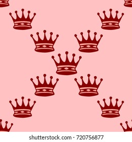 Seamless texture. Crowns on a pink background