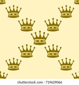 Seamless texture. Crowns on a yellow background