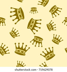 Seamless texture. Crowns on a yellow background
