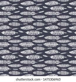 Seamless texture of engraving with white feathers on a gray background.