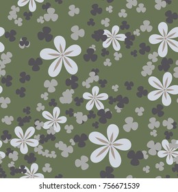 Seamless texture of five colors. Randomly arranged flowers and trefoils.