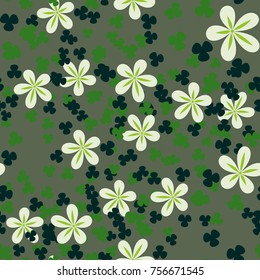 Seamless texture of five colors. Randomly arranged flowers and trefoils.