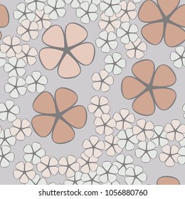 Seamless texture. Flowers of four colors, geometrically regular shape, two contrasting sizes