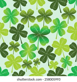 Seamless texture of the four-leaf clover. Vector.