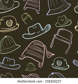 Seamless texture with headdresses on a brown background