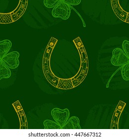 Seamless texture with horseshoes and four-leaf clover. Graphic arts. Background. Repeated pattern.  St.Patrick 's Day.