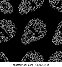 Seamless texture with the image of skulls on a black background. Vector image of white skulls with pattern.