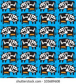 Seamless texture with the image of the spotted cow on a blue background / Vector cow pattern