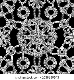 Seamless texture with lacy flowers a black background. Continuous pattern of flowers. Suitable for design: cloth, web, wallpaper, wrapping