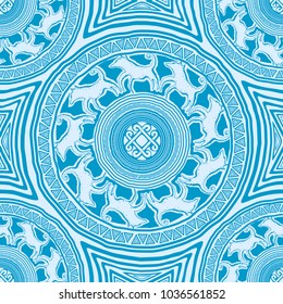 seamless texture with mandalas in primitive, ethnic style rock cave figure with animal ornament of the wolves and a solar sign in the center (blue and white colors)