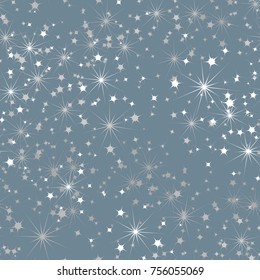 Seamless texture from multi-colored stars. Chaotic spread. Festive texture.