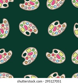Seamless texture with palettes with paint against a dark background