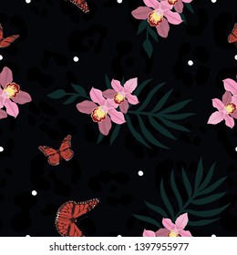 Seamless texture of panther skin combined with orchiaa, butterflies and palm leaves. Vector image.