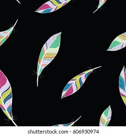 Seamless texture pattern of colored feathers on black background, vector illustration